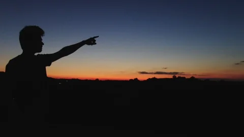 A man silhouette at amazing sunset. Stock Footage 115360448
