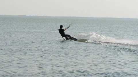 Man silhouette bends back rides on board edge slow motion Stock Footage 118992972