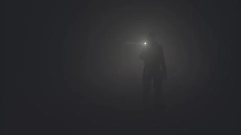 Man Silhouette with Flashlight Walking Through Thick Fog at Night Vídeo Stock 331774151