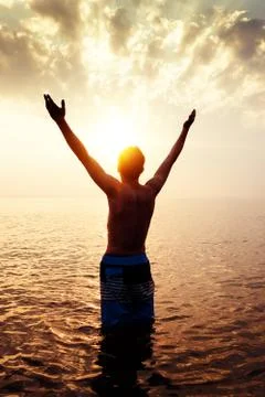 Man Silhouette with Hands Up Foto stock