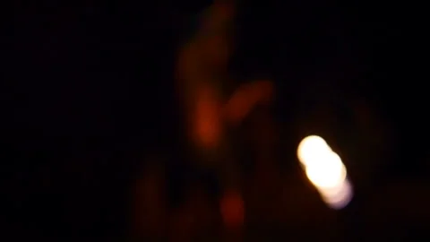Man silhouette performs fire dancing with torches at night Video stock 102487830