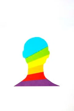 The man silhouette with a rainbow inside made of paper Stock Illustration