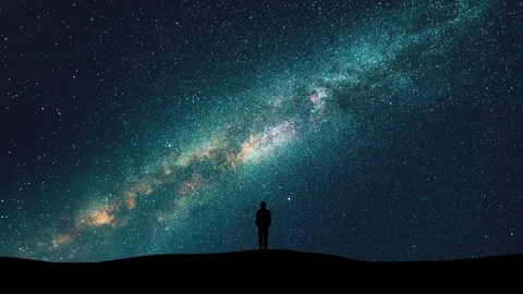The man silhouette on the starry sky background. time lapse Stock Footage 107928779