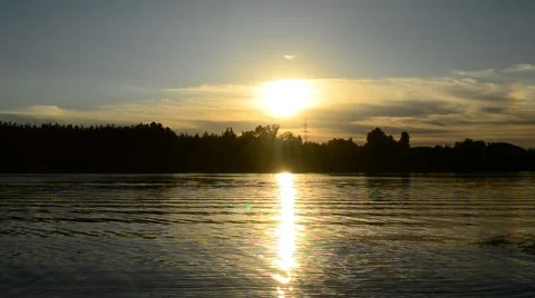 Man silhouette walks through frame on background of setting sun Stock Footage 67248834
