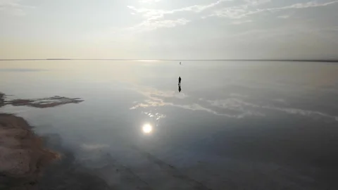A man silhouette in a water Stock Footage 104402313