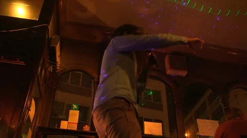 Man Sing and Dance at Karaoke Night 스톡 동영상 129197864