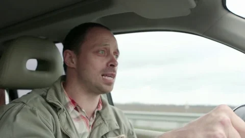 Man singing and dancing happy driving car in city Video stock 75318591