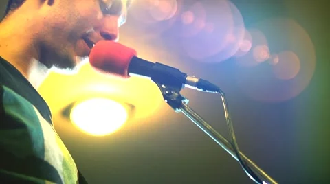 Man singing and playing guitar Stock Footage 67357546
