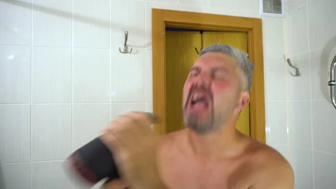 A man singing in the bathroom 4K Video stock 156771869