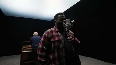 A Man Singing With A Pianist Inside A Studio Video stock 236512407
