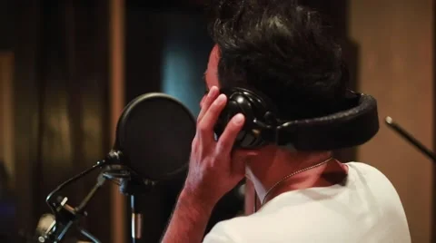 Man singing at a recording studio Stock Footage 55724935