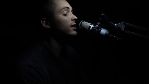 Man singing In Recording Studio with microphone Stock Footage