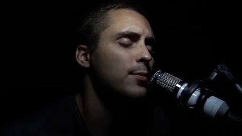Man singing In Recording Studio with microphone Stock Footage