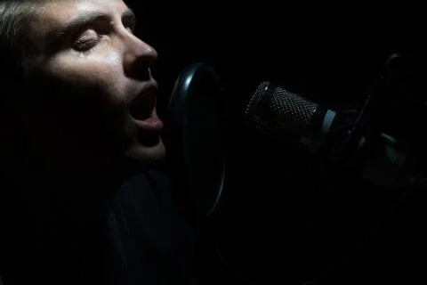 Man singing In Recording Studio with microphone Stock Photos