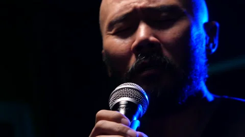 Man singing  on stage Stock Footage 130963356