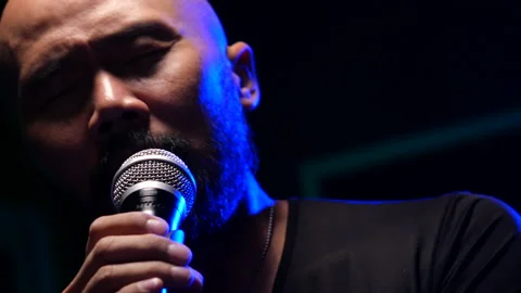 Man singing  on stage Stock Footage 130963394