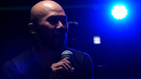 Man singing  on stage Stock Footage 130963400