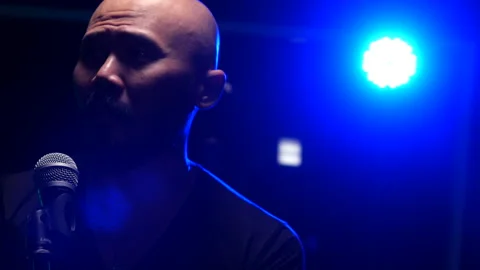 Man singing  on stage Stock Footage 130963407