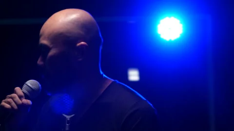 Man singing  on stage Stock Footage 130963434