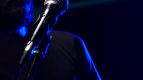 Man singing  on stage Stock Footage 130964380