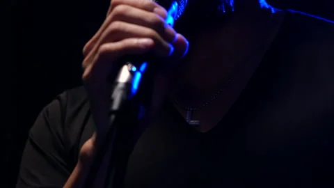 Man singing  on stage Stock Footage 130964540