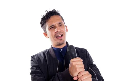 Man singing with wireless microphone. White background. Young singer screaming Stock Photos