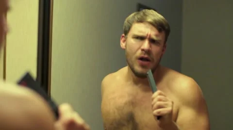 Man sings and dances around the mirror Stock-Footage 68284824