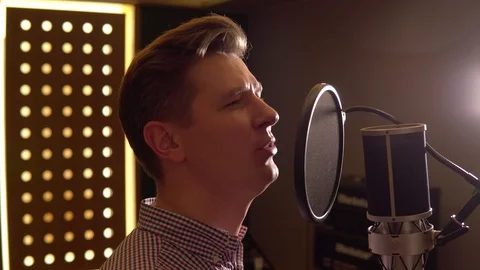 Man sings in recording studio. Face close up Stock Footage 104625077