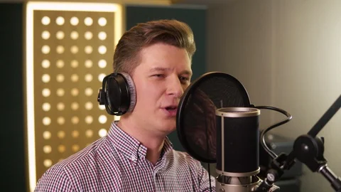 Man sings in recording studio. Face close up Video stock 104627190