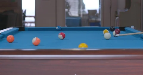 Man Sinking Pool Ball in Side Pocket on Blue Billiards Table Stock Footage 88227183