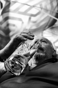 Man sipping a cold drink Stock Photos
