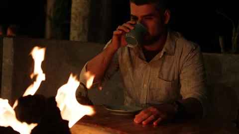 Man sipping tea at restaurant.. Stock Footage 273543808