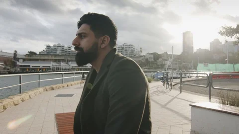 Man Sips Coffee Looking at Bay Water In Sydney Harbor. Mid Shot Dolly Stock Footage 129547310