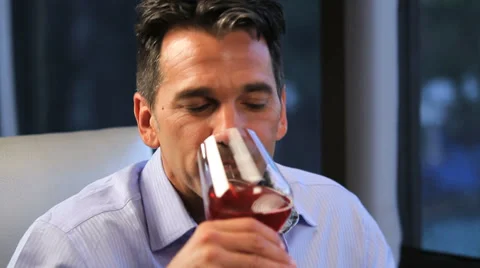 Man sips wine at dinner Stock Footage 36764973