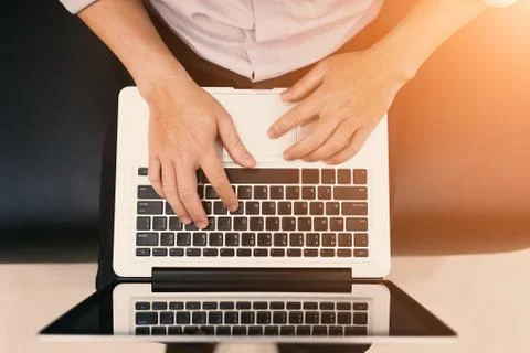 A man sit and using notebook Stock Photos