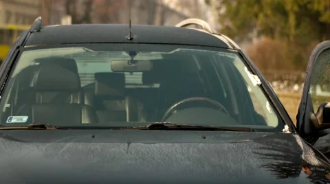 The man sit into in the car and making phone call Stock Footage 59565057