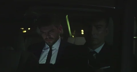 Man sit with driver in car at night. Stock Footage 119073773