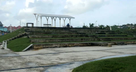  man, sited on a bench, melancholy looking at the sea. cloudy fresh weather  Stock Footage 103299146