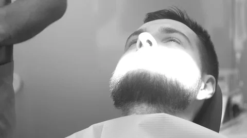 Man siting in dentist chair, pull up a tooth Stock Footage 81179812