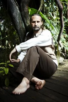 Man siting in wild Stock Photos