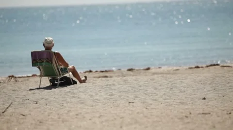 Man Sits Alone at the Beach 스톡 동영상 7132456