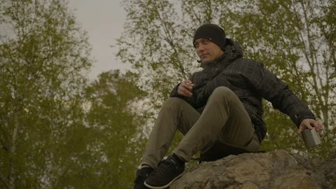 The man sits and smokes Stock Footage 94973775