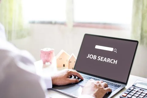 A man sits and typing keyboard to job search in the work at home. Find work.. Stock Photos