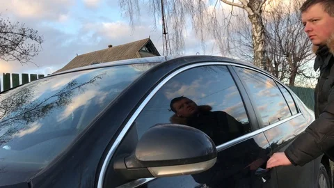 A man sits in a black car Stock Footage 111180855