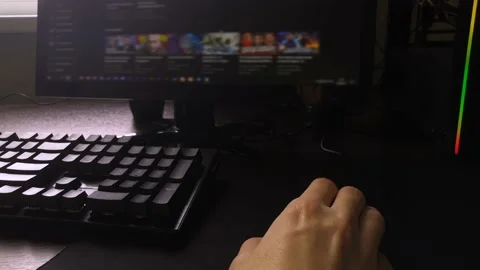 A man sits at the computer and looks through the search results in the browser Stock Footage 160555958
