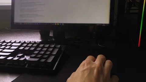 A man sits at a computer and looks through the search results in the browser Stock Footage 160555998