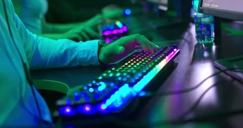Man sits at a computer and presses the buttons on the keyboard with his fingers Stock Footage 127012812