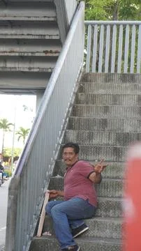 A man sits on the crossing steps Stock Photos