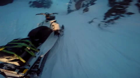 Man sits down behind a snowmobile and starts it Video stock 102161936