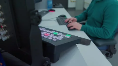 A man sits down on a chair in the background of control panel Video stock 276925339